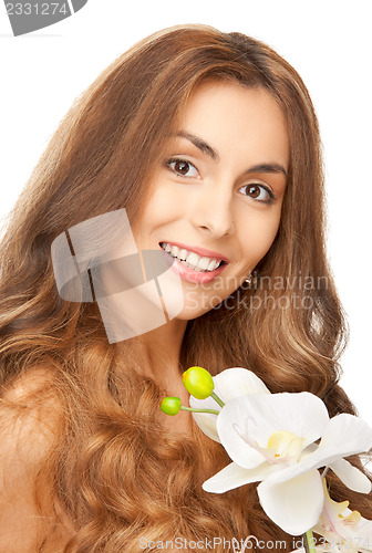Image of beautiful woman with orchid flower