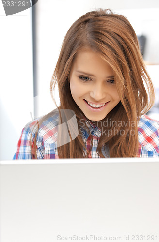 Image of happy woman with laptop computer