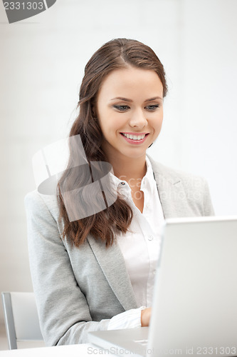 Image of happy woman with laptop computer