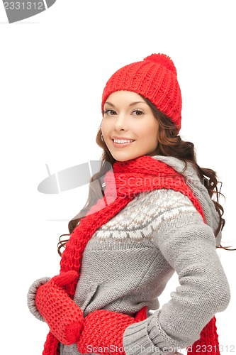 Image of beautiful woman in hat, muffler and mittens