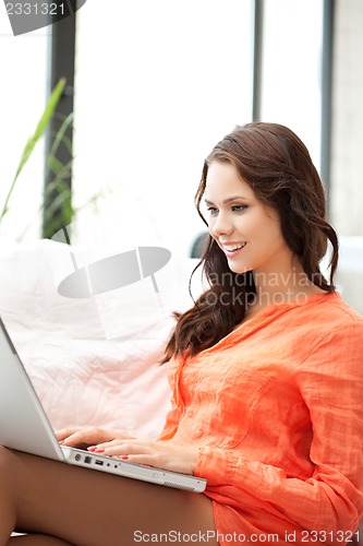 Image of happy woman with laptop computer