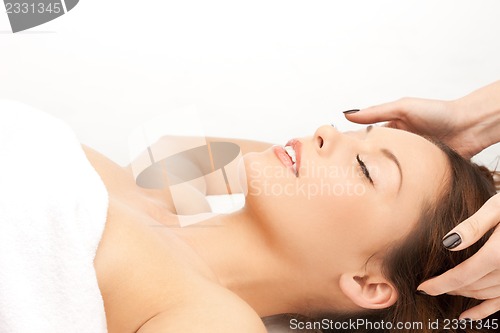 Image of beautiful woman in massage salon