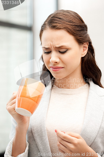 Image of lovely businesswoman with mug