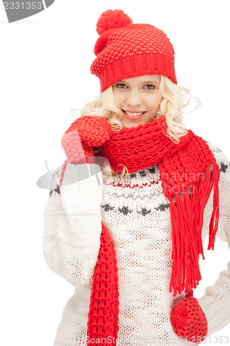 Image of beautiful woman in hat, muffler and mittens