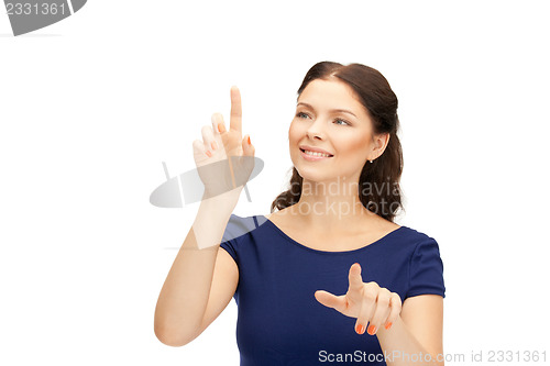 Image of businesswoman working with something imaginary