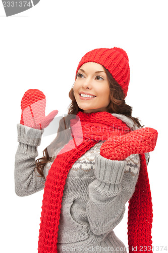 Image of beautiful woman in hat, muffler and mittens