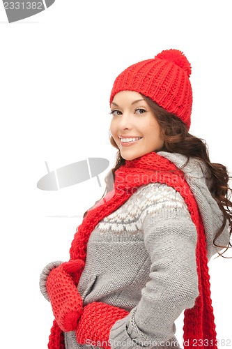 Image of beautiful woman in hat, muffler and mittens