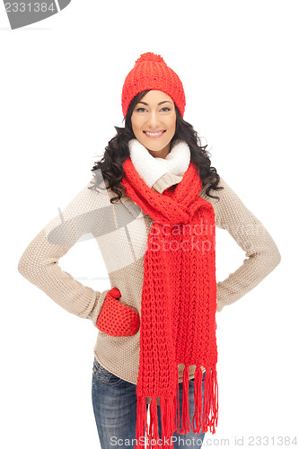 Image of beautiful woman in hat, muffler and mittens