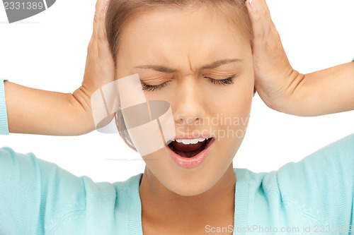 Image of woman with hands on ears