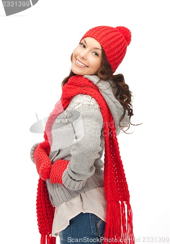 Image of beautiful woman in hat, muffler and mittens
