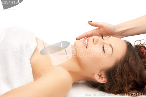 Image of beautiful woman in massage salon