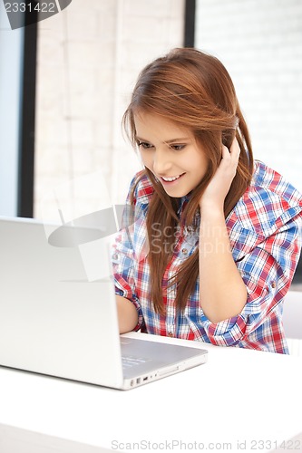Image of happy woman with laptop computer