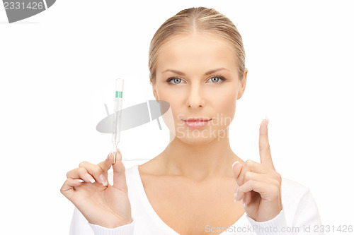 Image of attractive female doctor with thermometer