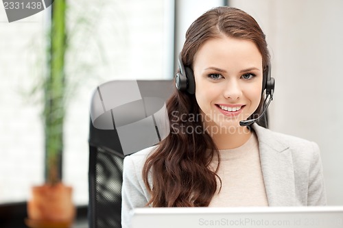 Image of helpline operator with laptop computer