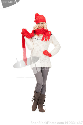 Image of beautiful woman in hat, muffler and mittens