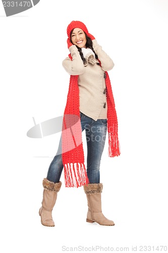 Image of beautiful woman in hat, muffler and mittens