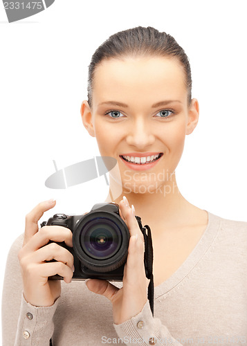 Image of teenage girl with digital camera