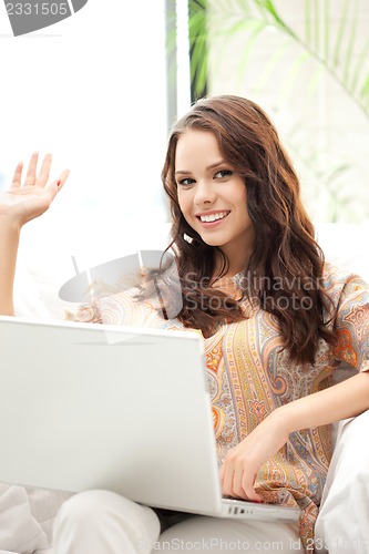 Image of happy woman with laptop computer