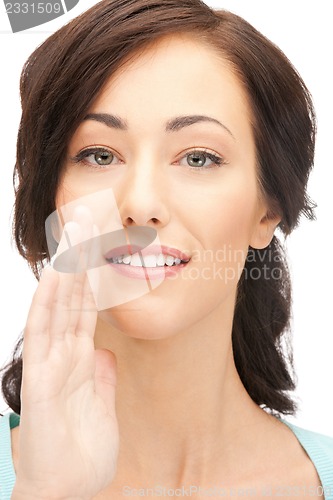 Image of woman whispering gossip