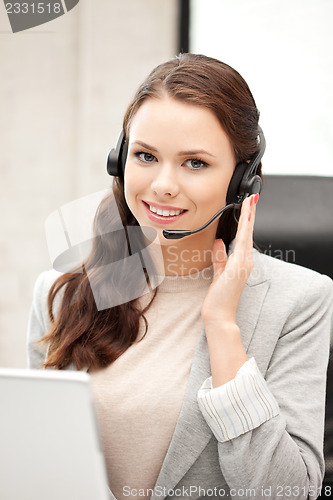 Image of helpline operator with laptop computer