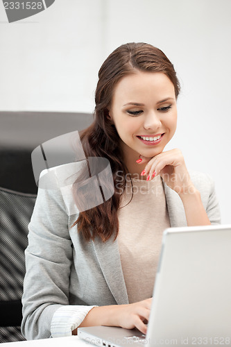 Image of happy woman with laptop computer