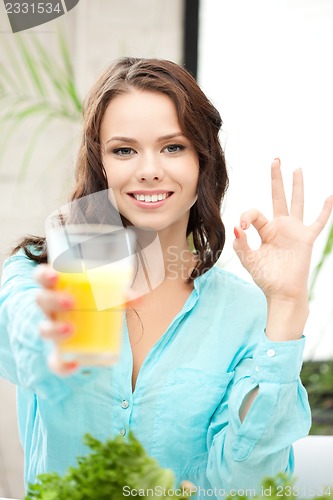 Image of beautiful woman with glass of juice
