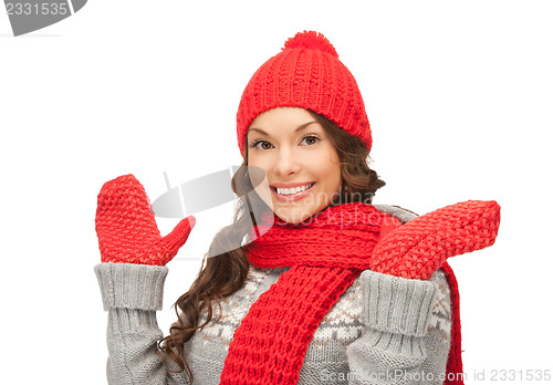 Image of beautiful woman in hat, muffler and mittens