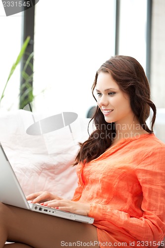 Image of happy woman with laptop computer