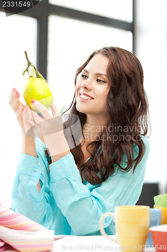 Image of lovely woman with lemon