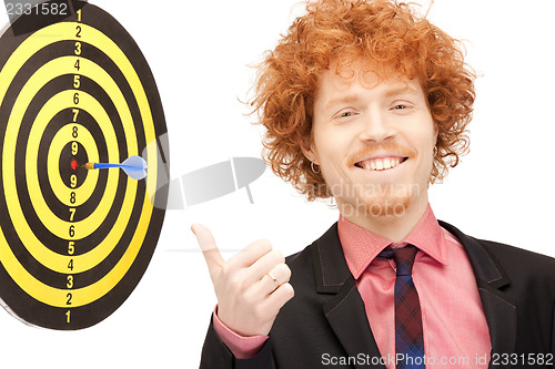 Image of businessman with dart and target