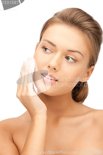 Image of beautiful woman with cotton pad