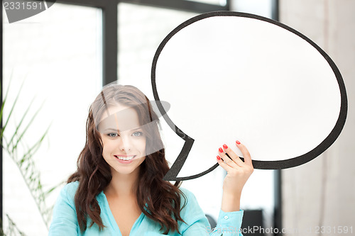 Image of smiling woman with blank text bubble