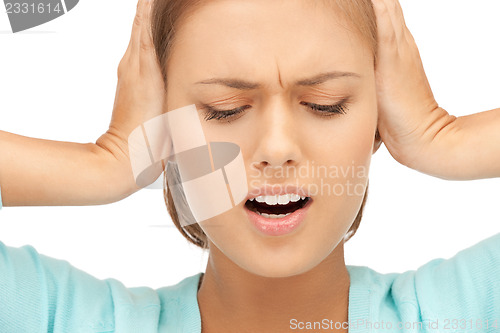 Image of woman with hands on ears