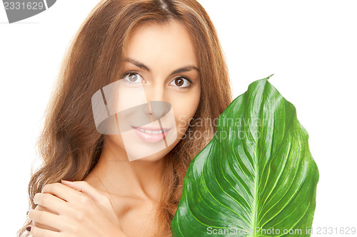 Image of woman with green leaf