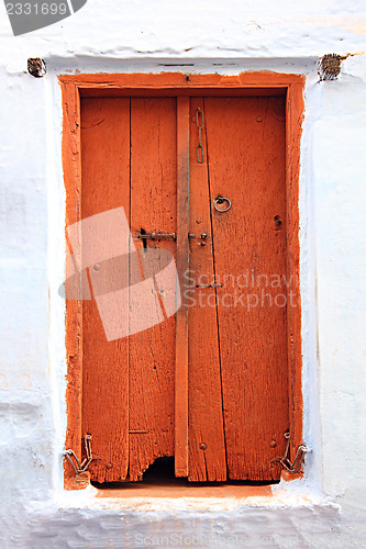 Image of old wooden closed door in india