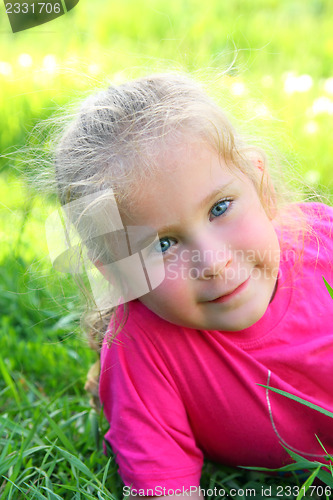 Image of smiling little girl outdoor portrait