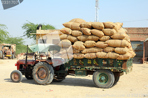 Image of tractor loaded with bags in india