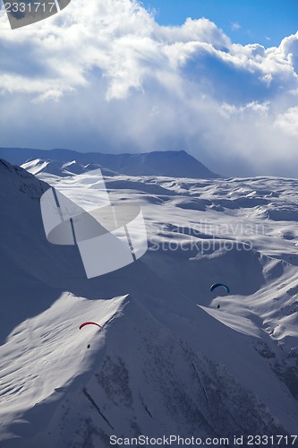 Image of Sky gliding in snowy mountains