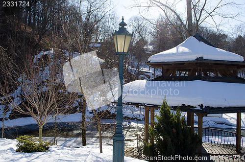 Image of wooden bower roof snow retro lighting river winter 