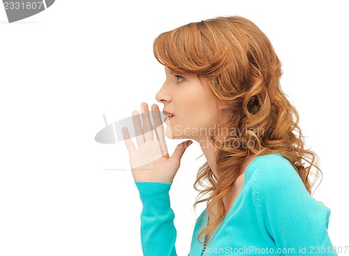 Image of teenage girl whispering gossip