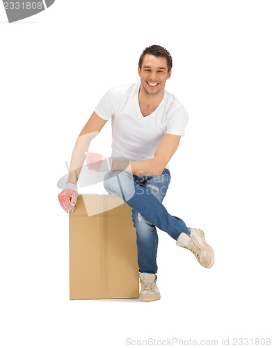 Image of handsome man with big box
