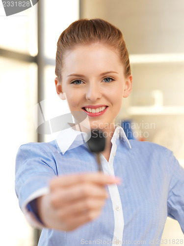 Image of happy woman with car key