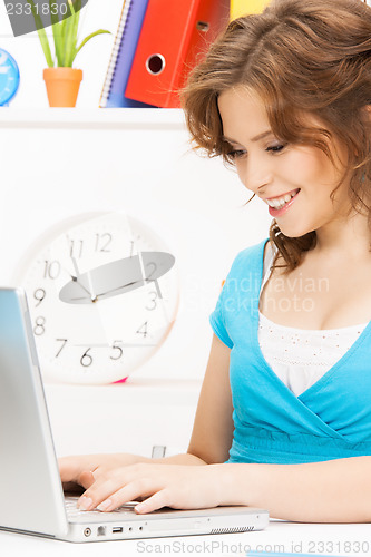 Image of happy woman with laptop computer