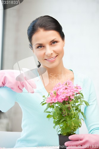 Image of lovely housewife with flower