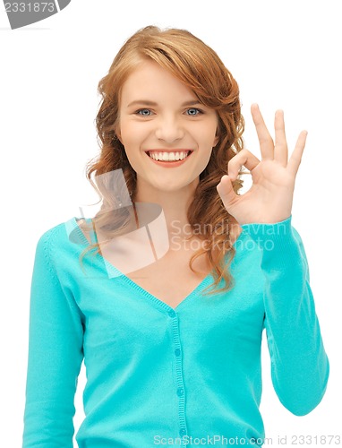 Image of teenage girl showing ok sign