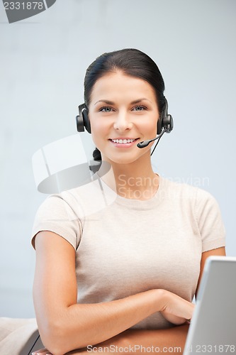 Image of helpline operator with laptop computer