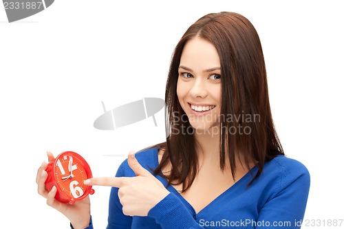 Image of woman holding alarm clock