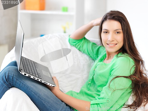 Image of happy woman with laptop computer