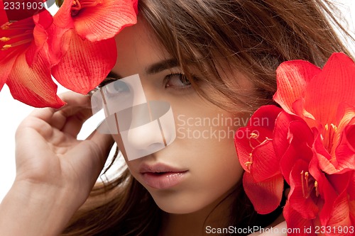 Image of lovely woman with red flowers