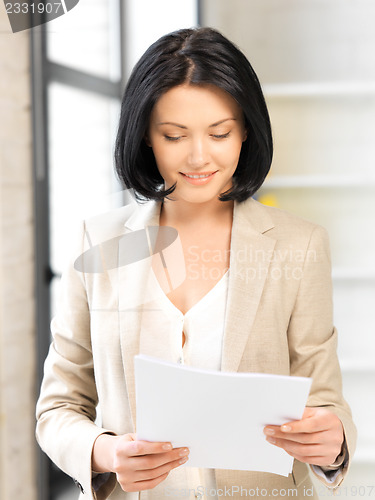 Image of happy woman with documents